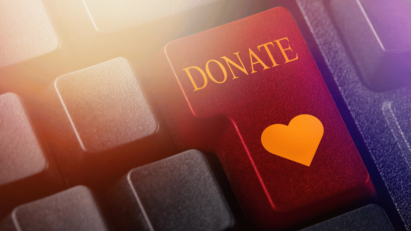 Donate button with heart on computer keyboard.